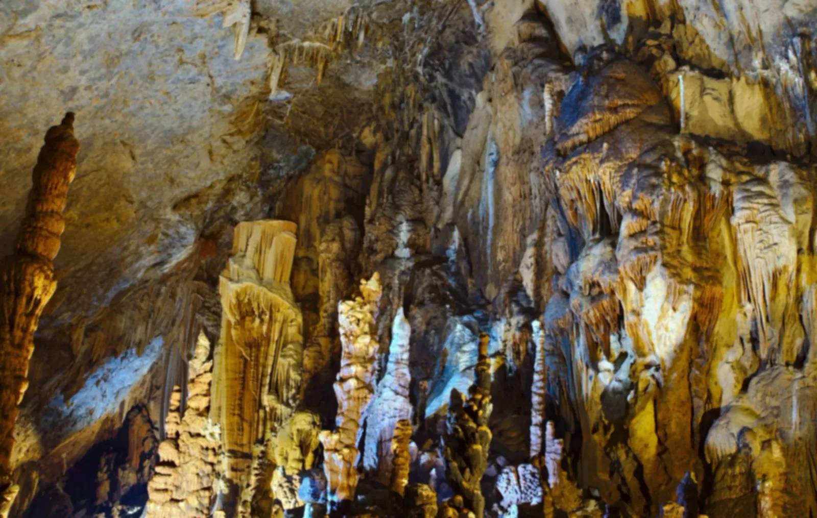 Stalactites and stalagmites inside Lung Khuy cave