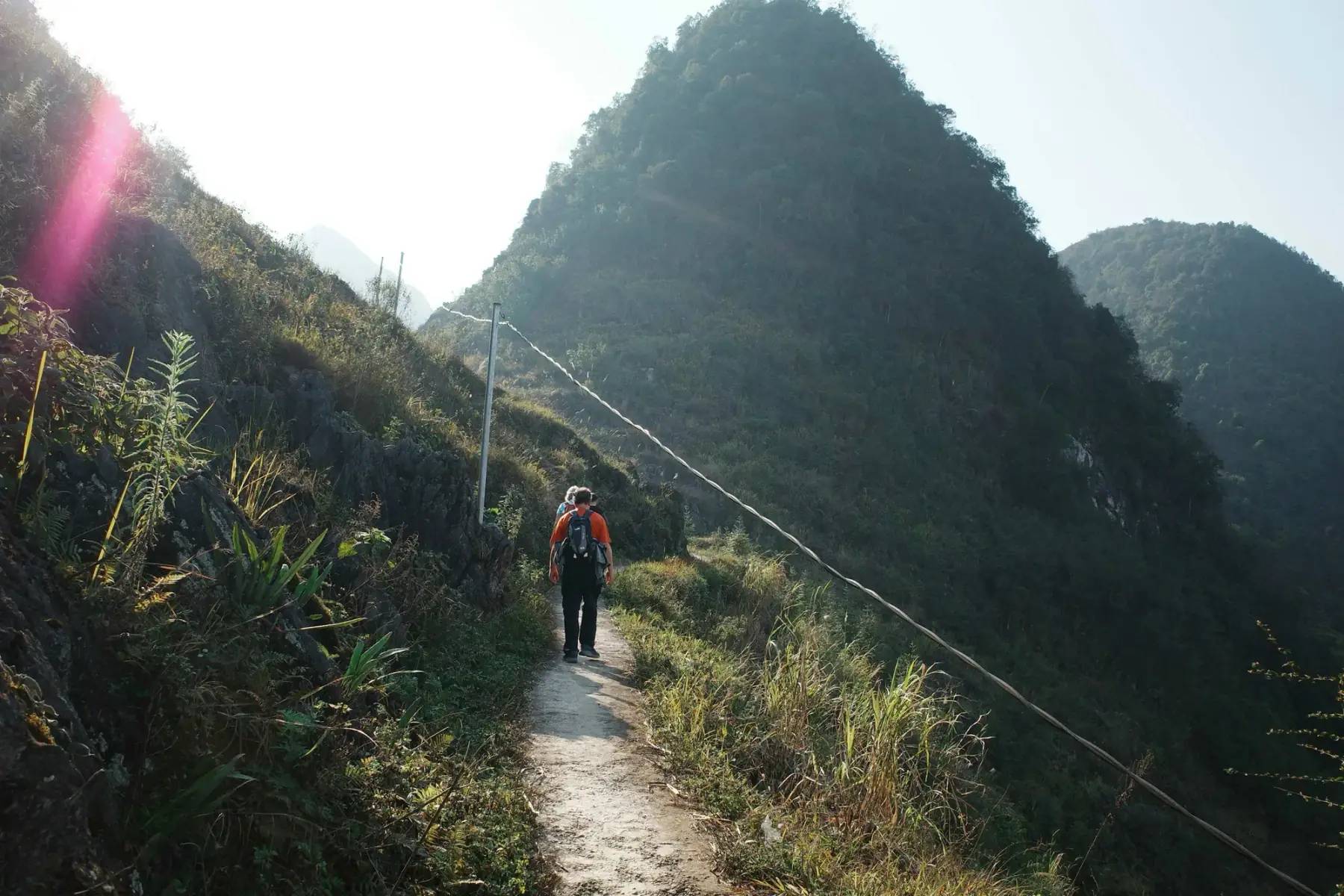 A walker on a mountain path in Ha Giang in winter
